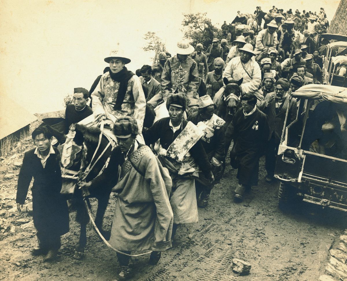 The young Dalai Lama crossing into India through the Nathu La Pass, in 1956