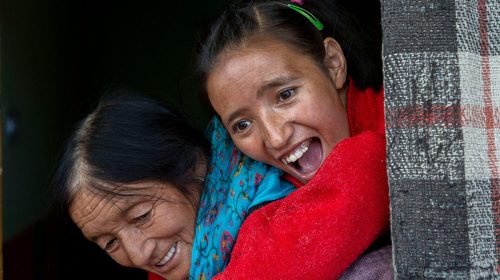 63-year-old Stanzin Dolma walks uphill and downhill in the village of Lingshed, Ladakh carrying her 24-year-old daughter Stanzin Otsala on her back. Stanzin contracted brain tuberculosis 10 years ago. Photo Credit: Vicky Roy.